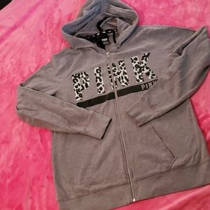 Pink zip up hoodie. Cheetah print on front. Size L
